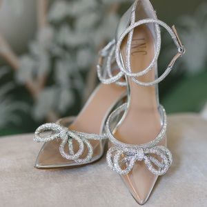 Never worn, sequin bow, translucent pointed-toe pump.